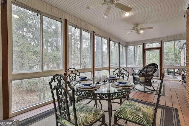 sunroom featuring a ceiling fan