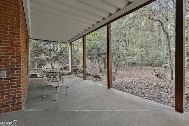 view of patio / terrace with a view of trees