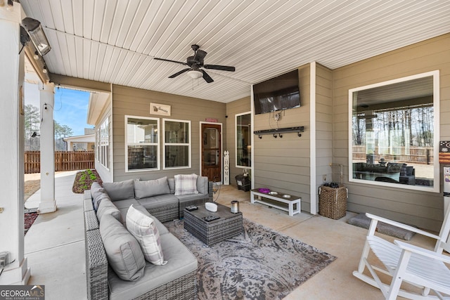 view of patio / terrace featuring outdoor lounge area, ceiling fan, and fence