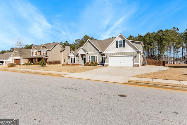 craftsman-style house featuring board and batten siding, driveway, and a garage