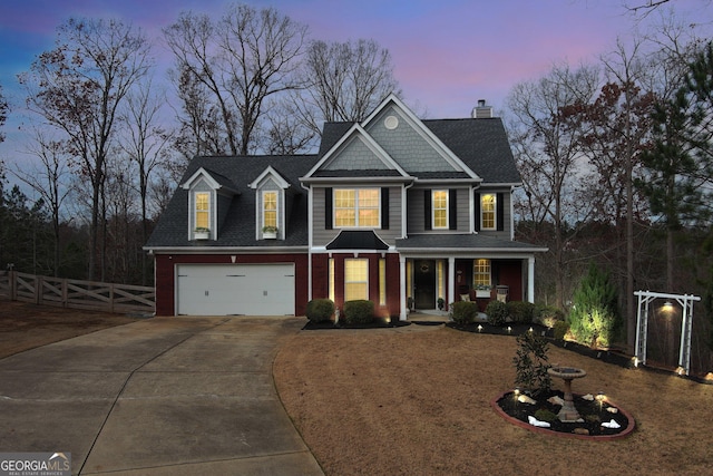 view of front facade with brick siding, a porch, concrete driveway, an attached garage, and fence