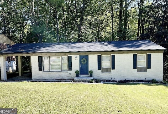 single story home featuring a front yard, crawl space, and brick siding