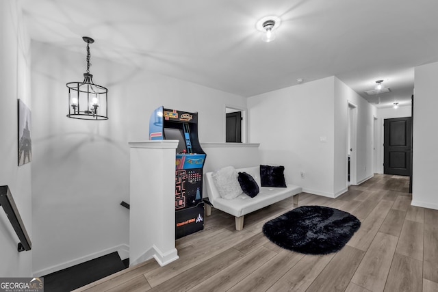 sitting room featuring baseboards and wood finished floors