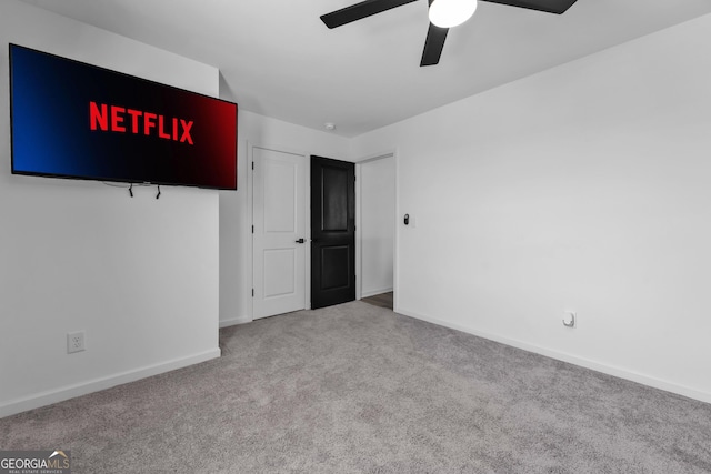 unfurnished bedroom featuring ceiling fan, baseboards, and carpet flooring