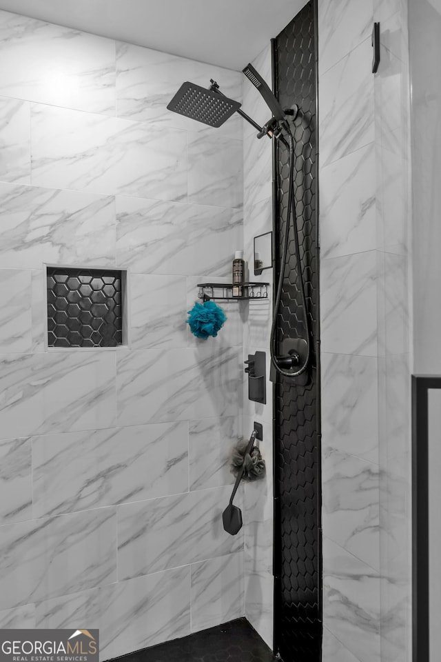 bathroom with tiled shower