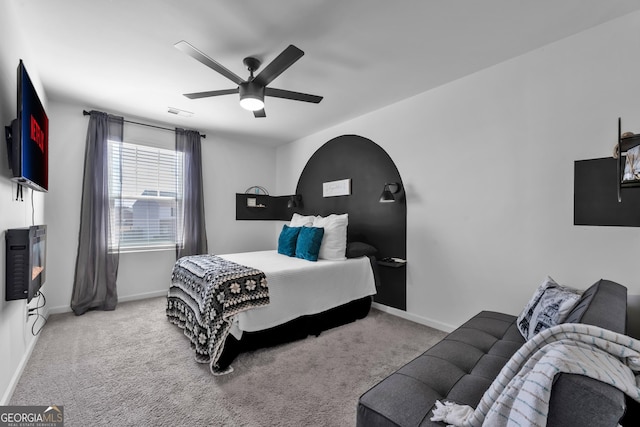 bedroom with carpet, baseboards, and a ceiling fan