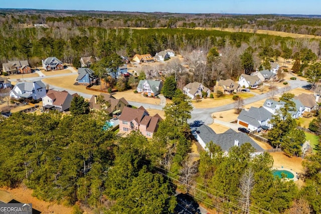 bird's eye view featuring a residential view and a forest view