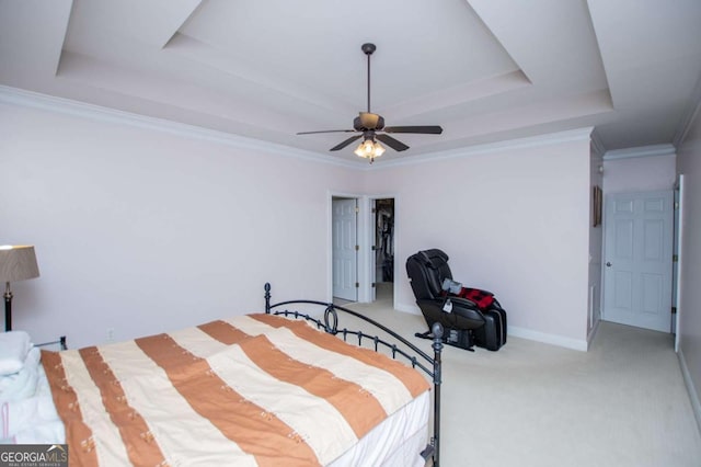 bedroom featuring a ceiling fan, baseboards, ornamental molding, carpet, and a raised ceiling