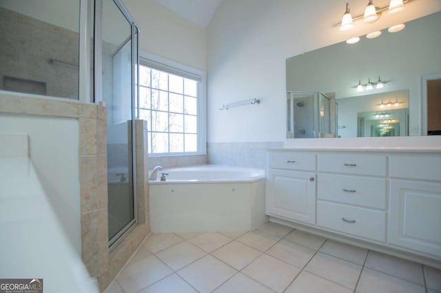 full bath with vanity, a stall shower, tile patterned flooring, and a bath