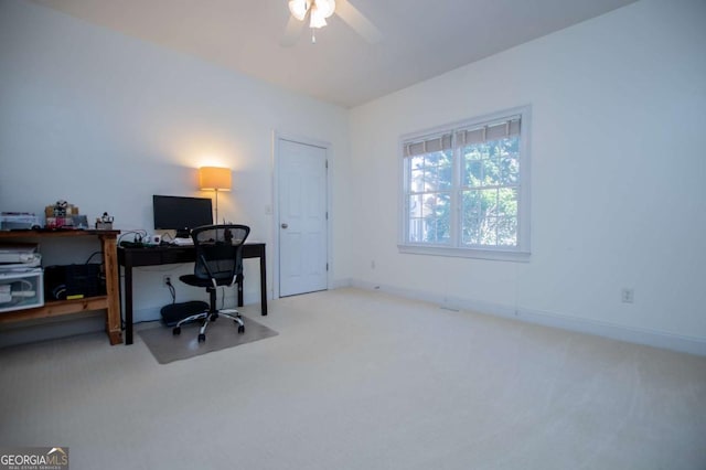 office area featuring carpet flooring, ceiling fan, and baseboards