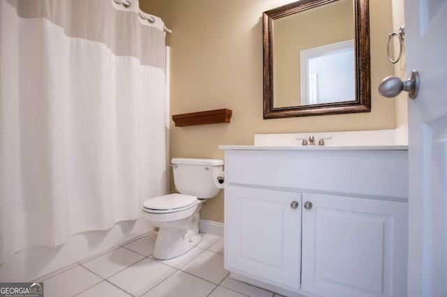 bathroom featuring toilet, tile patterned flooring, shower / bath combo with shower curtain, and vanity