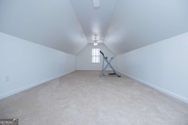 additional living space featuring lofted ceiling, ceiling fan, baseboards, and carpet flooring