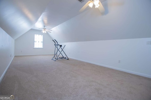 bonus room with vaulted ceiling, ceiling fan, carpet, and baseboards