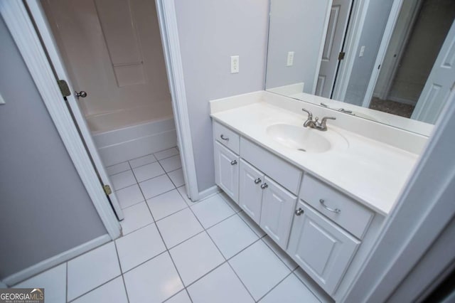 bathroom with tile patterned flooring, vanity, and shower / bathtub combination