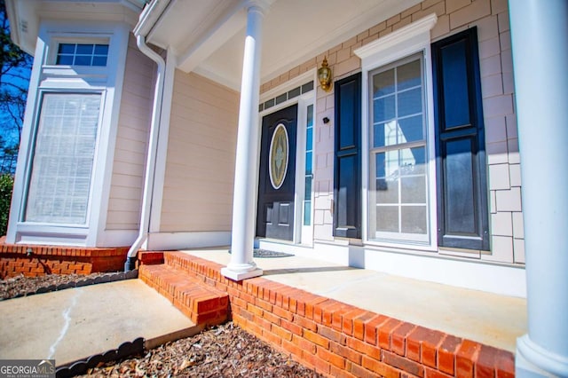 property entrance with covered porch