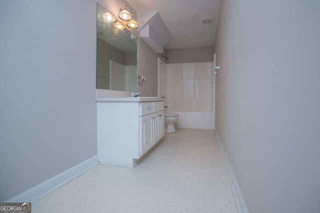 bathroom featuring visible vents, baseboards, toilet, vanity, and washtub / shower combination