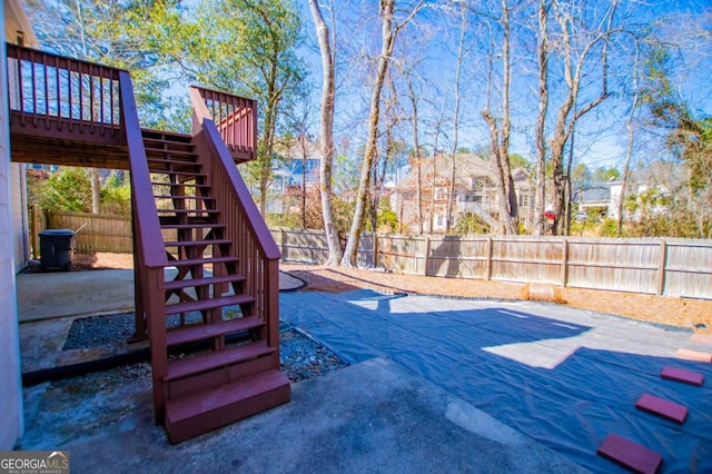 view of jungle gym with a patio, stairway, and a fenced backyard