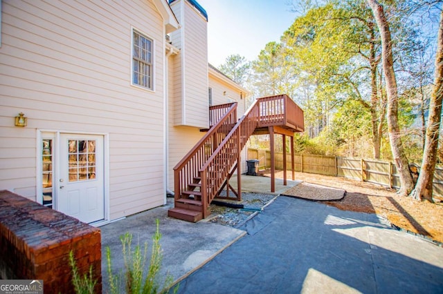 view of patio featuring a fenced backyard, stairway, a wooden deck, and central air condition unit