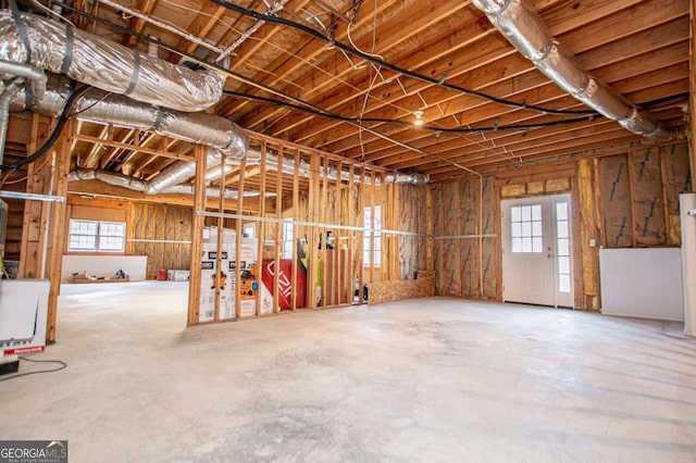 misc room with unfinished concrete flooring