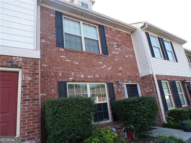 view of front of house featuring brick siding