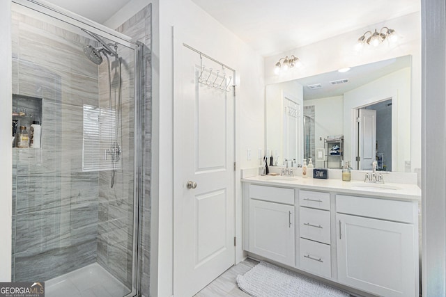 full bathroom featuring double vanity, a stall shower, a sink, and visible vents