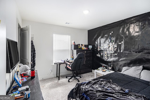 carpeted bedroom featuring visible vents