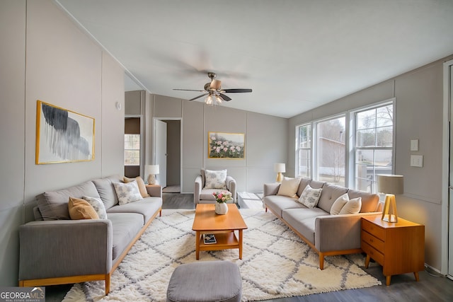 living room with vaulted ceiling, wood finished floors, and ceiling fan