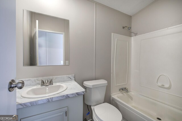 full bath with toilet, vanity, and shower / tub combination