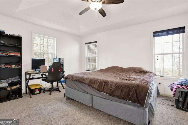 carpeted bedroom featuring a ceiling fan