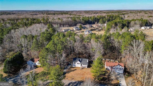 aerial view featuring a view of trees