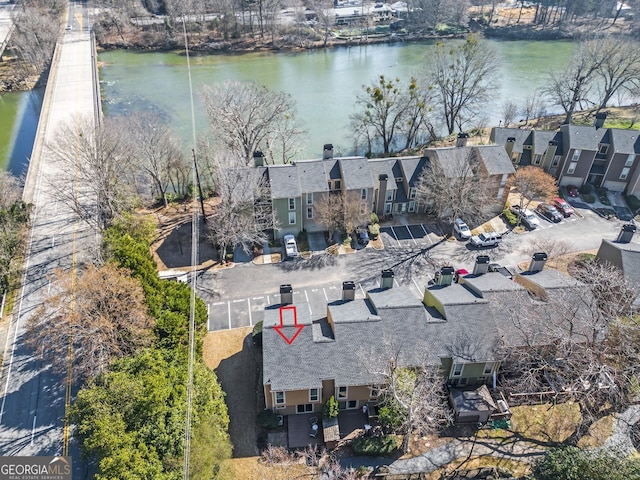 aerial view featuring a water view and a residential view