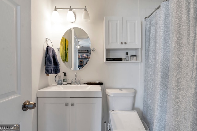 full bath featuring toilet, a shower with curtain, and vanity