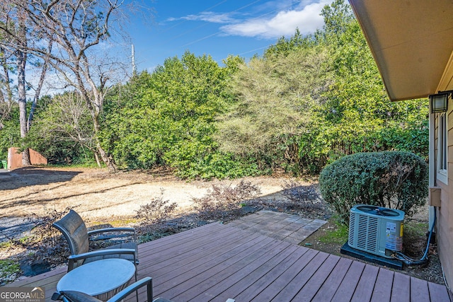 wooden terrace featuring central AC unit