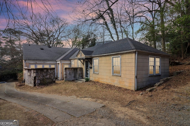 view of front of home with roof with shingles