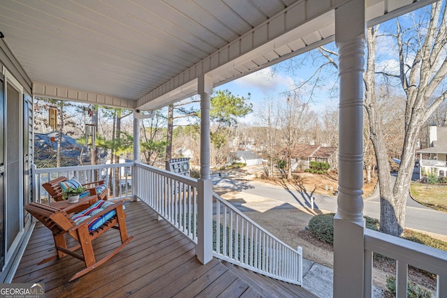 wooden deck featuring covered porch