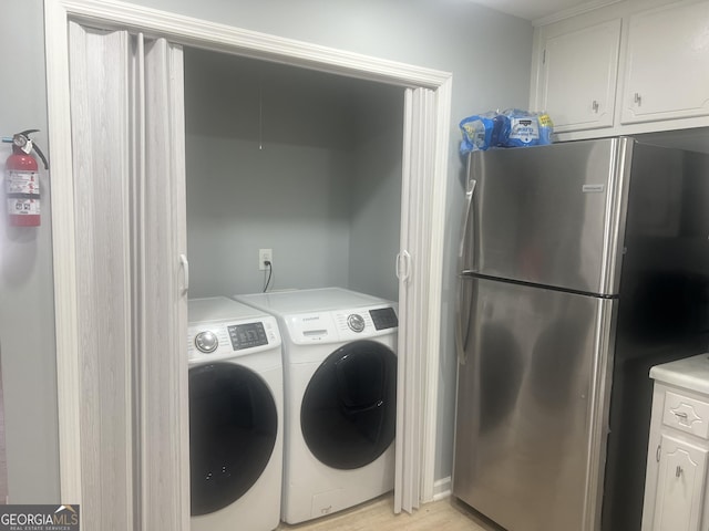 washroom with independent washer and dryer