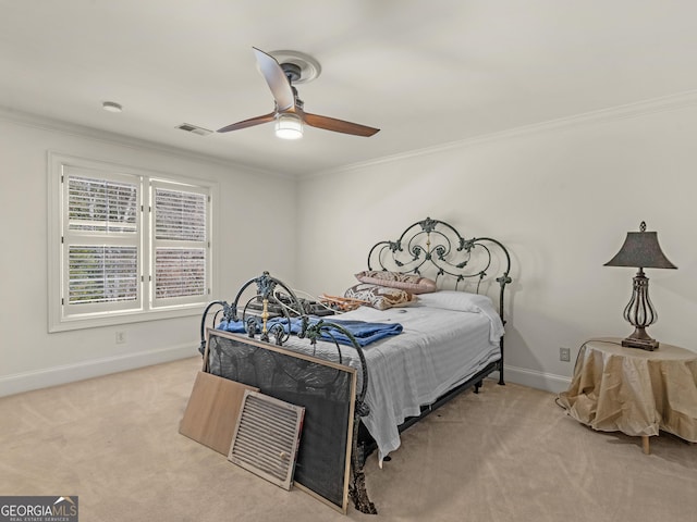 bedroom with ornamental molding, carpet, and visible vents