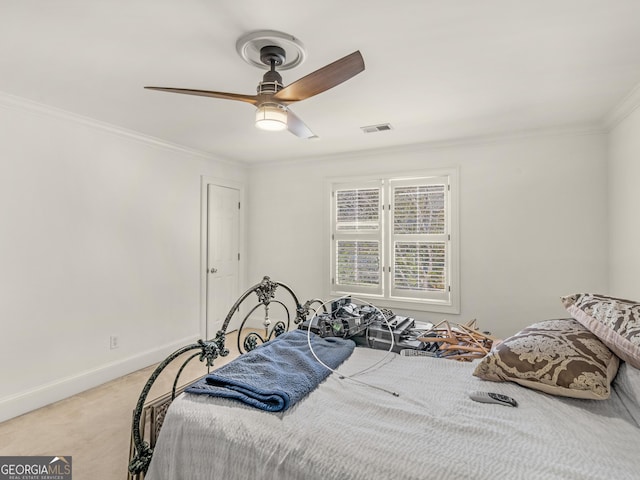 bedroom featuring baseboards, visible vents, light colored carpet, ceiling fan, and ornamental molding