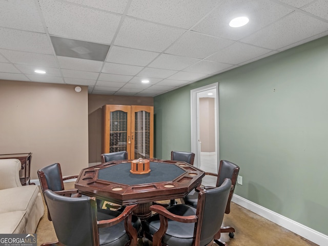 recreation room with french doors, a drop ceiling, recessed lighting, and baseboards