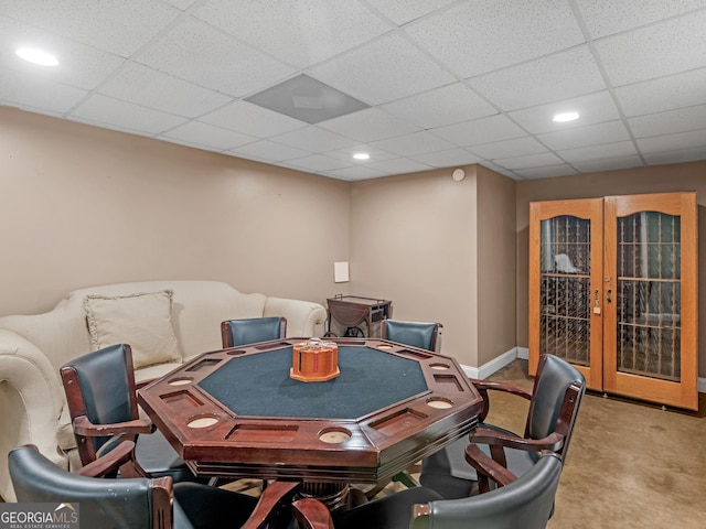 playroom featuring a paneled ceiling, recessed lighting, baseboards, and french doors