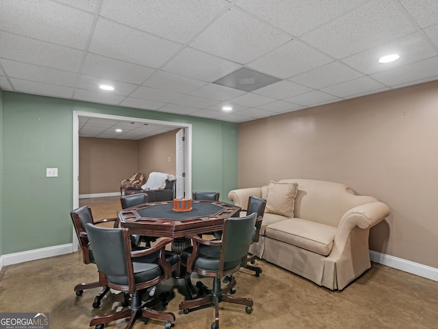 dining room with a drop ceiling, recessed lighting, and baseboards