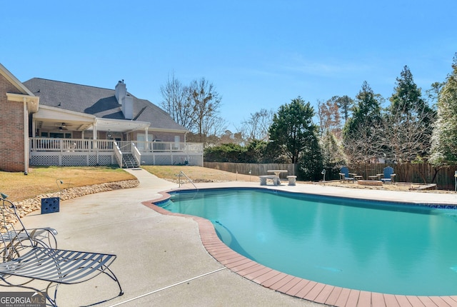 view of pool with a patio area, a fenced backyard, ceiling fan, and a fenced in pool