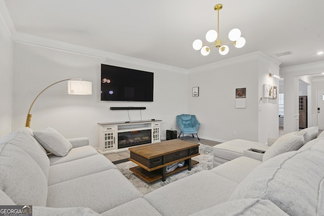 living room featuring crown molding, visible vents, wood finished floors, and a glass covered fireplace