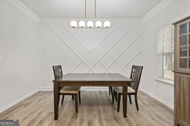 dining area with baseboards, ornamental molding, and light wood-style floors