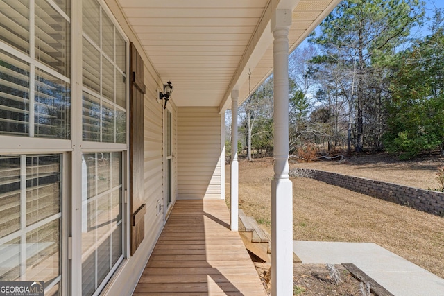 wooden terrace with a porch