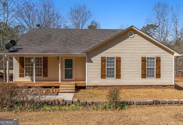 view of front of home featuring crawl space, covered porch, and roof with shingles