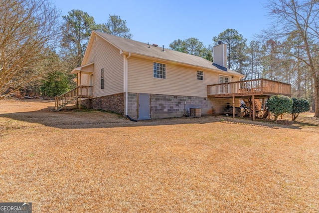 rear view of house featuring a chimney and central AC