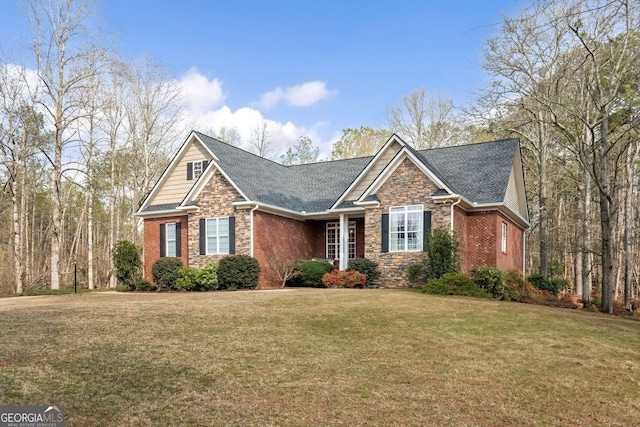 view of front facade with stone siding, a front lawn, and brick siding