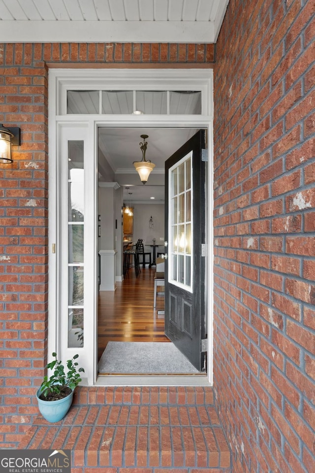 property entrance with brick siding