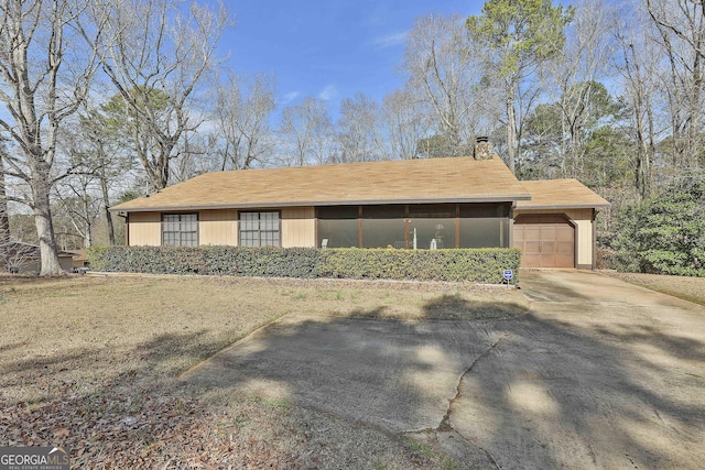 view of front facade featuring a garage and concrete driveway